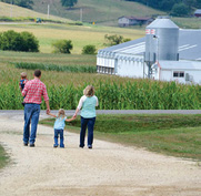 family walking down sidewalk image